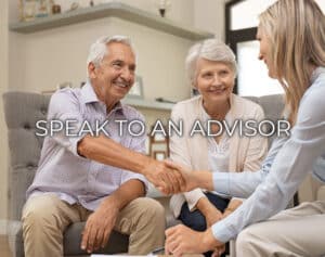 A senior couple shaking hands with an advisor that states Speak To An Advisor.