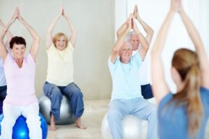 Older adults exercising to stay active.
